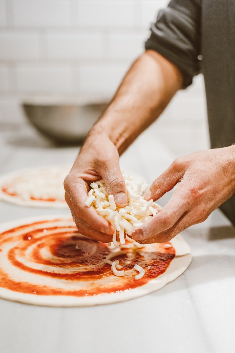 Close-up of Man Making Pizza