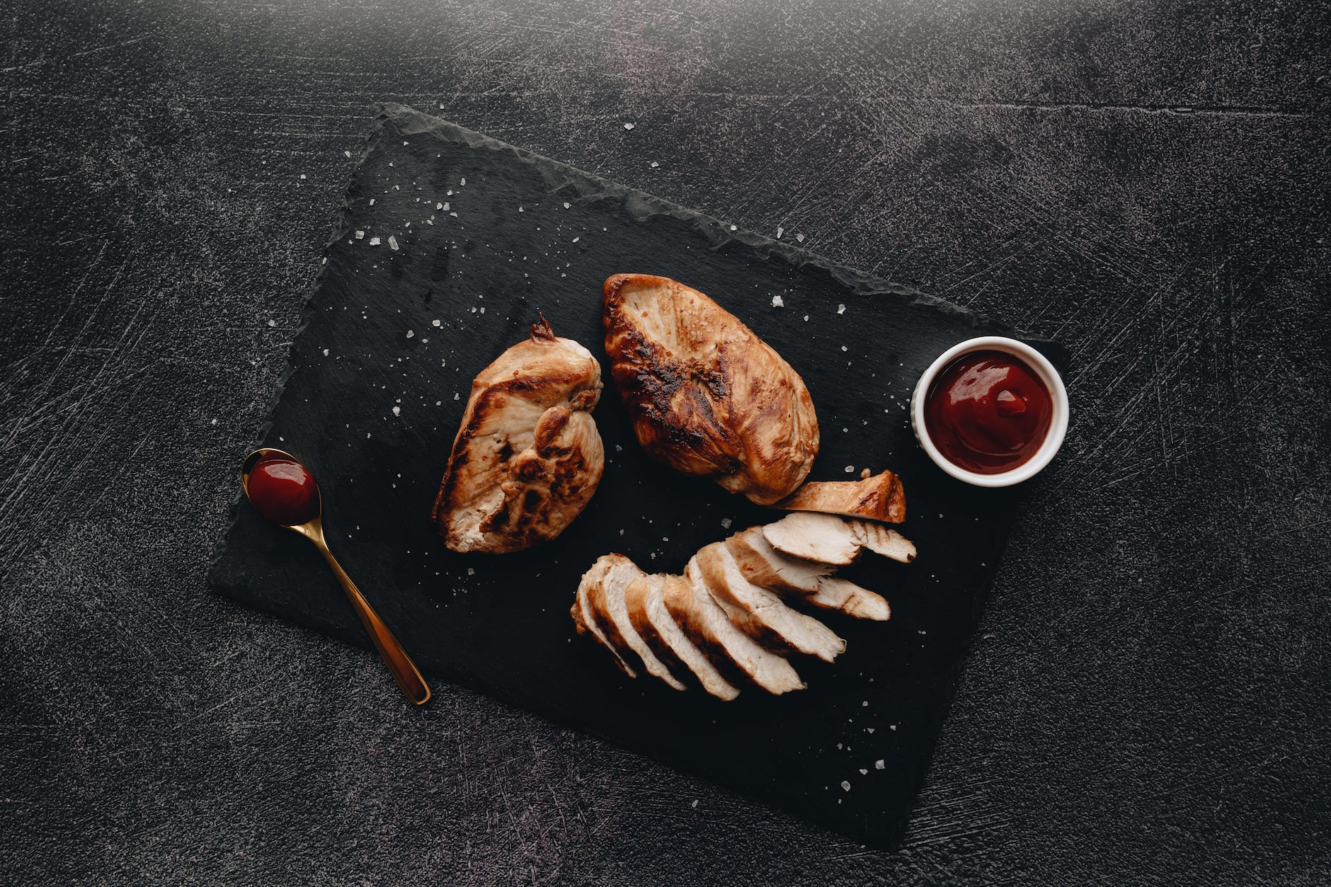 Photo by alleksana on <a href="https://www.pexels.com/photo/roasted-chicken-breasts-with-sauce-on-the-side-6107756/" rel="nofollow">Pexels.com</a>
