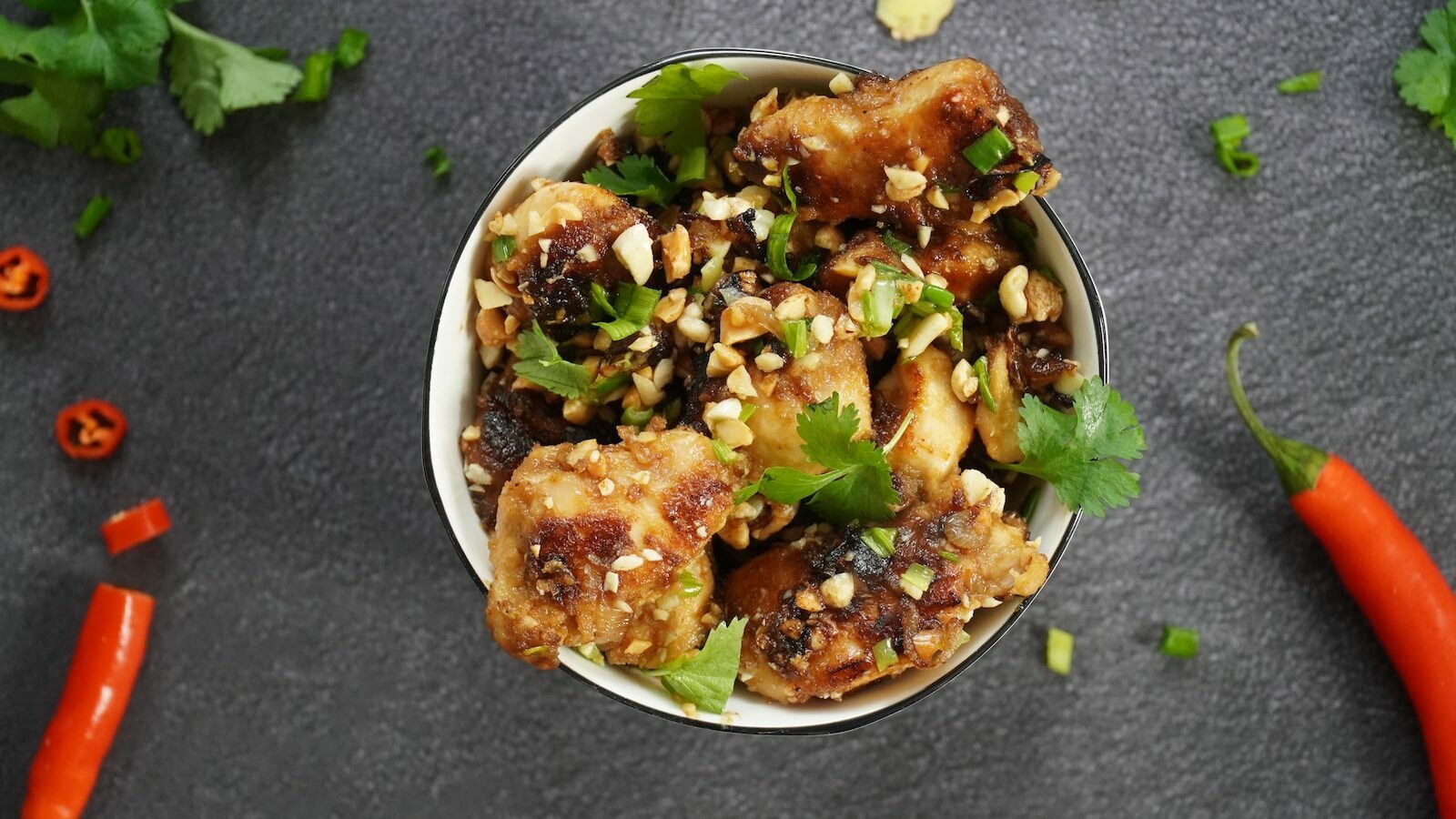 cooked chicken kung pao on white ceramic bowl