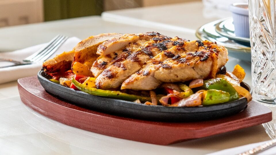 A Delicious Grilled Chicken on a Sizzling Plate